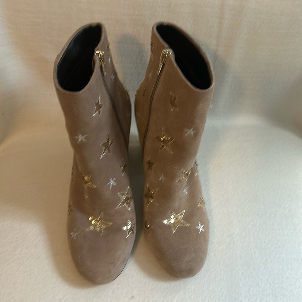 Light brown suede booties with rhinestone and embroidered stars, gently warm